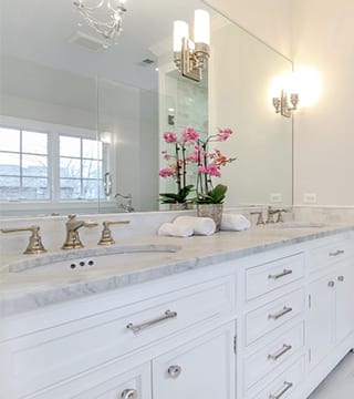 White, grey, carrera marble bathroom design in Wilmette 