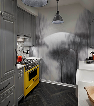 Elegant grey kitchen design with bright yellow stove and wall decor in Chicago